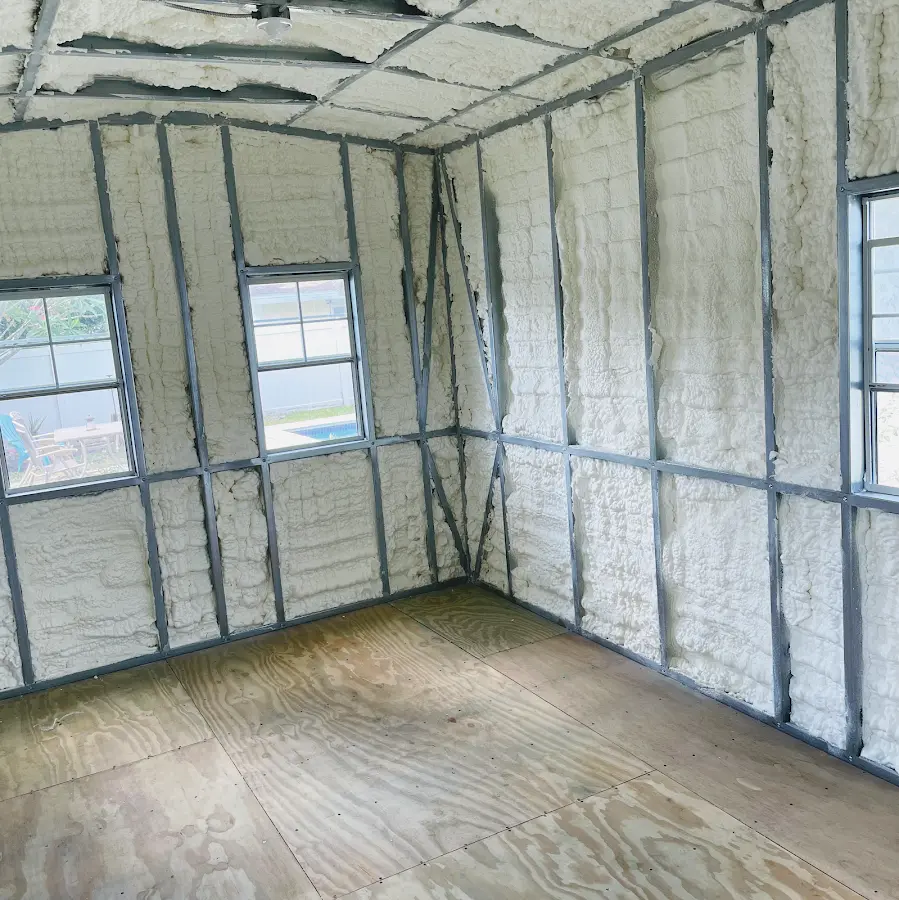 Closed-cell spray foam insulation applied to wall cavities in a residential project in Weston